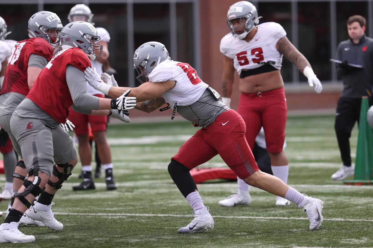 Washington State edge rusher Brennan Jackson, right, competes in one-on-one linemen drills during a spring camp practice Saturday at Rogers Field in Pullman.  (WSU Athletics)