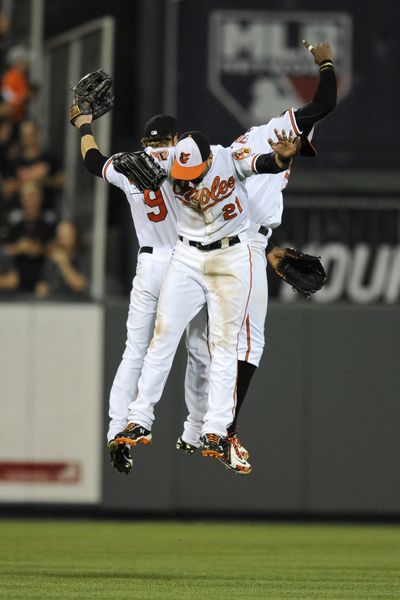 The Orioles celebrate after completing a sweep of M’s. (Associated Press)
