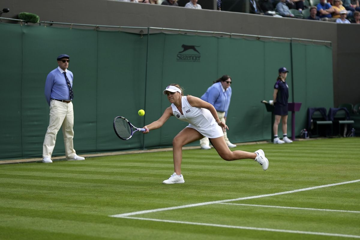 Sofia Kenin of the US returns the ball to China's Xiyu Wang during the women's singles match on day one of the Wimbledon Tennis Championships in London, Monday June 28, 2021.  (Associated Press)