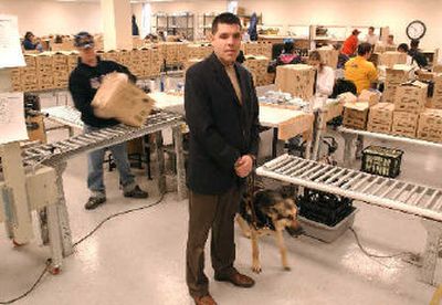 
Danny Novielli of Bosma Industries for the Blind is in the Indianapolis production center with his dog Venice at his side.
 (Associated Press / The Spokesman-Review)