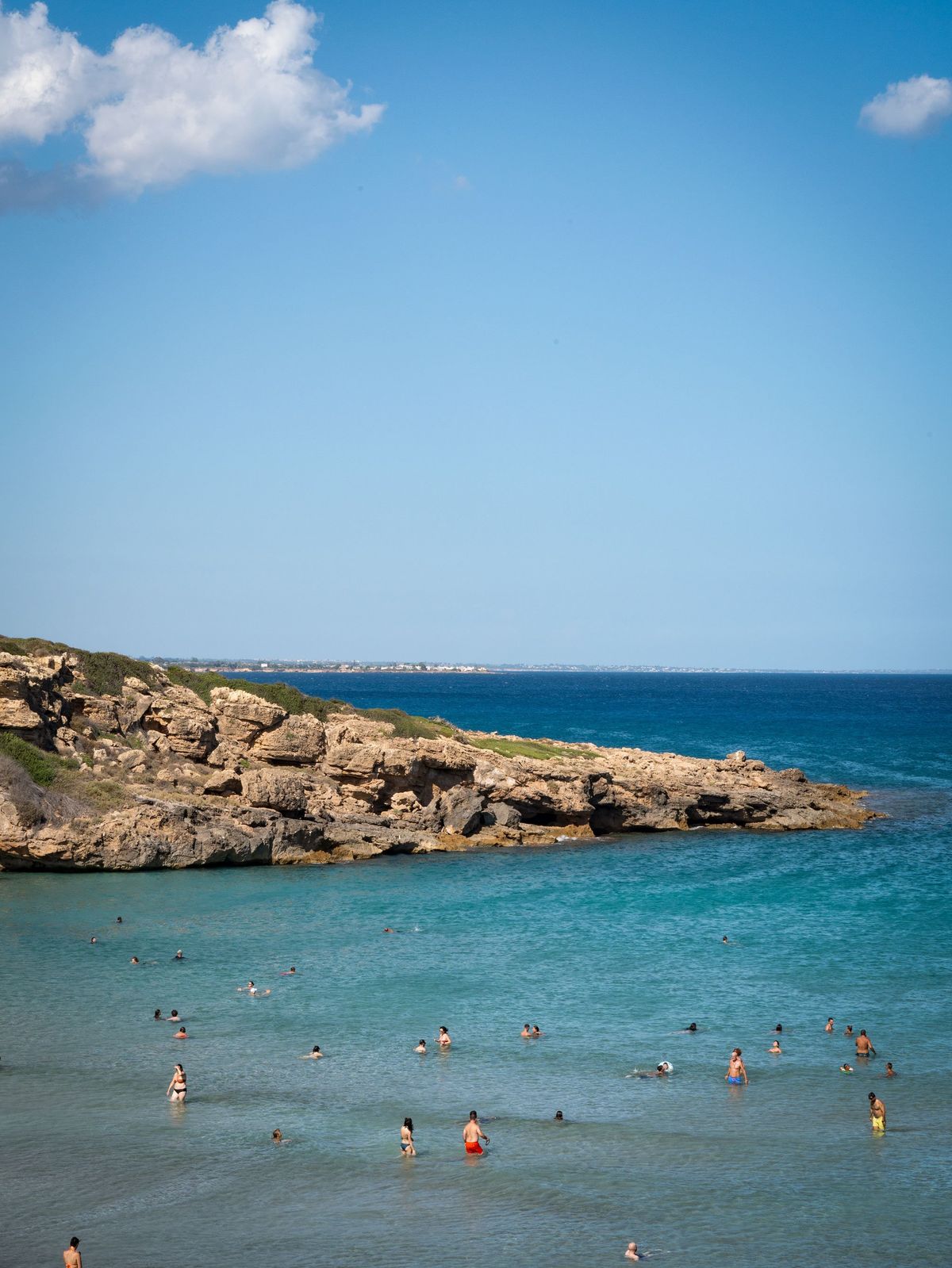 Swimmers enjoy the water at Calamosche Beach in September.  (Massimo Siragusa/Agence Vu/For The Washington Post)