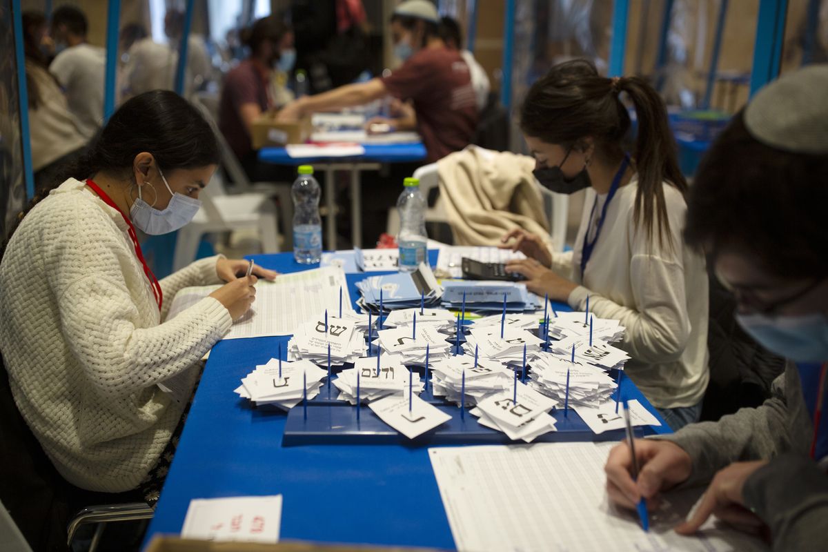 Workers count votes in Israel