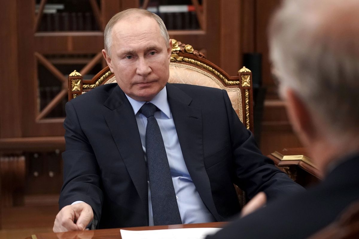 Russian President Vladimir Putin listens to General Director of the Russian Direct Investment Fund Krill Dmitriev at the Kremlin in Moscow, Russia, Friday, April 2, 2021.  (Alexei Druzhinin)