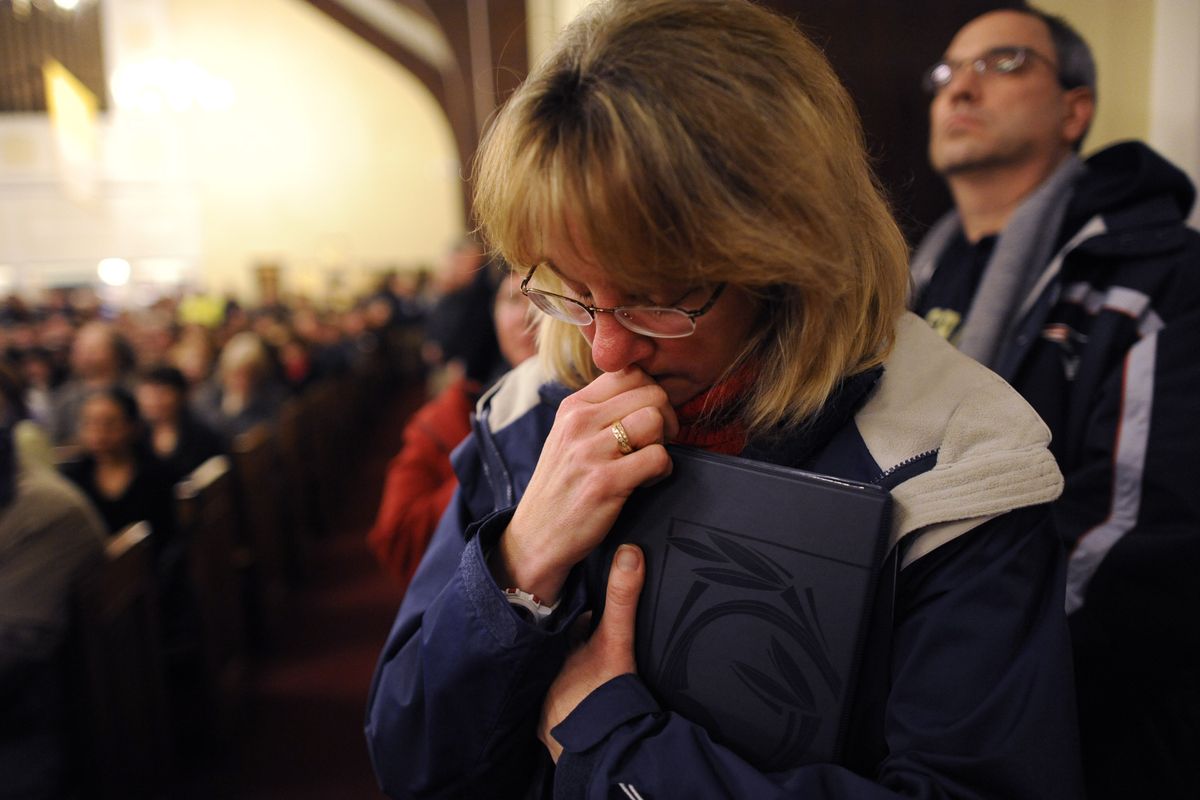 Mourners gather at a vigil service for victims of the Sandy Hook Elementary School shooting, at the St. Rose of Lima Roman Catholic Church in Newtown, Conn. Friday, Dec. 14, 2012. A man killed his mother at their home and then opened fire Friday inside the elementary school where she taught, massacring 26 people, including 20 children, as youngsters cowered in fear to the sound of gunshots reverberating through the building and screams echoing over the intercom (Andrew Gombert / Pool Epa)