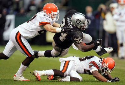 Oakland's LaMont Jordan (34) rushed for more than 1,000 yards in his first season with the Raiders.
(Associated Press / The Spokesman-Review)