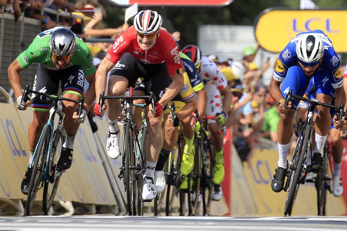 Colombia’s Fernando Gaviria, right, crosses the finish line to win the fourth stage of the Tour de France cycling race over 195 kilometers (121 miles) with start in La Baule and finish in Sarzeau, France, Tuesday, July 10, 2018. Slovakia’s Peter Sagan, left, finished second and Germany’s Andre Greipel, center, third. (Peter Dejong / Associated Press)