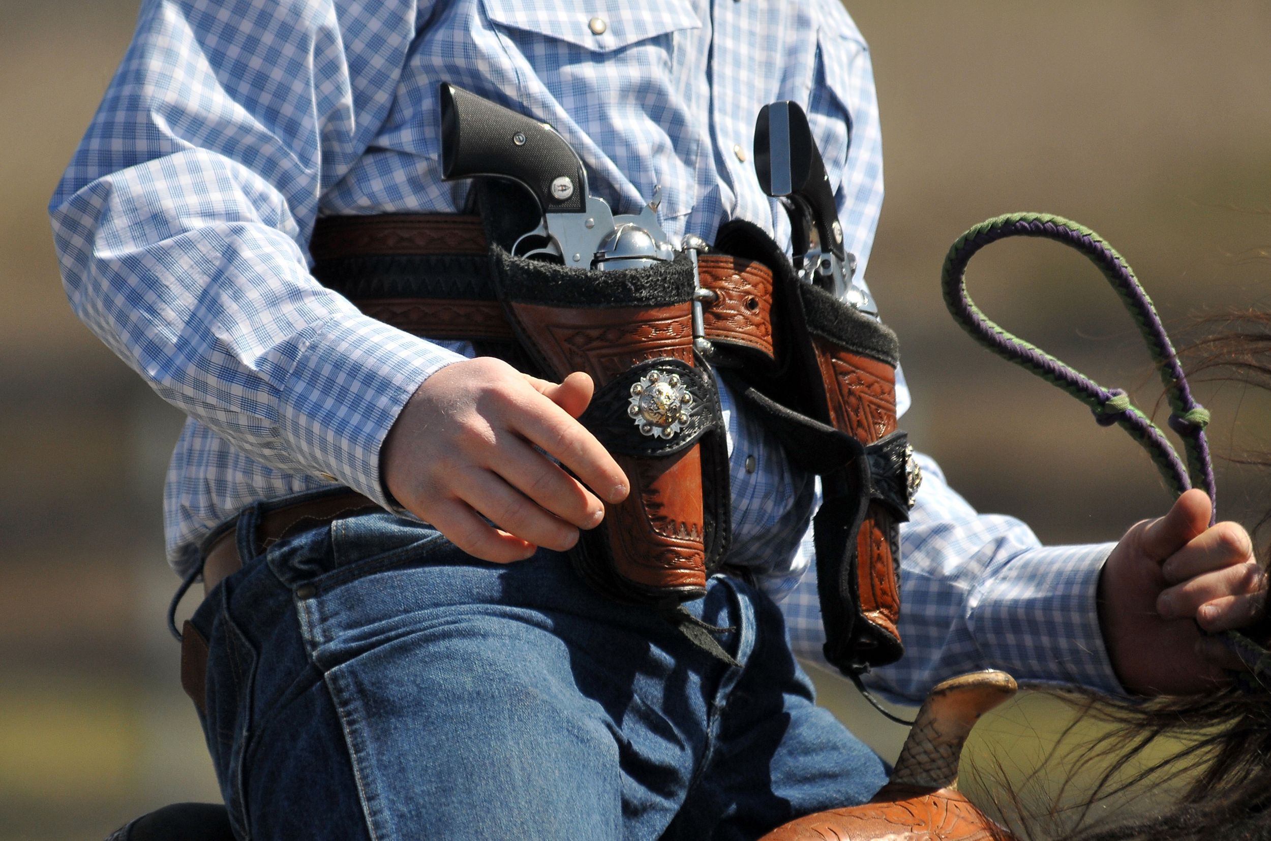 Cowboy mounted shooting holsters top