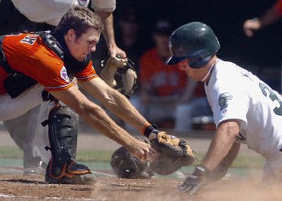 
Oregon State catcher Mitch Canham tags out Tulane's Scott Madden at home plate in the seventh. 
 (Associated Press / The Spokesman-Review)