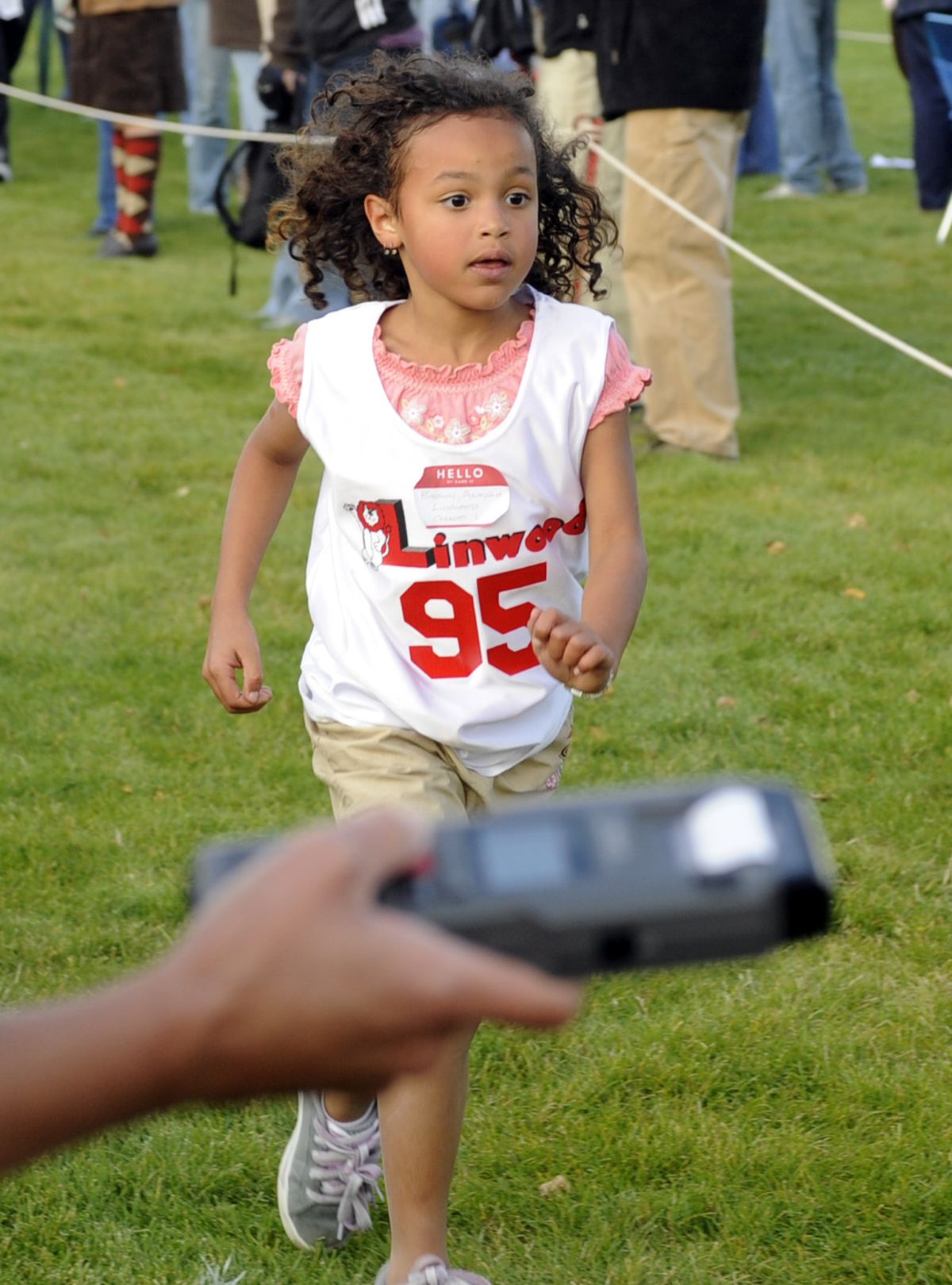 First-grader Anayah Brown from Linwood Elementary School finishes first in her race at Loma Vista Park in north Spokane. (The Spokesman-Review)