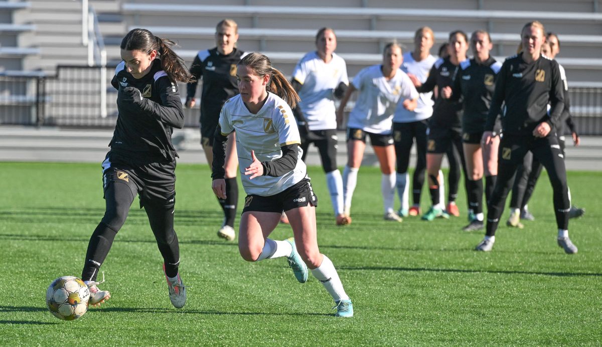 Sophia Braun, left, picks up a goal kick during a scrimmage Friday with teammates of the USL’s Spokane Zephyr at ONE Spokane Stadium. The Zephyr open the second half of their season Saturday in Tampa, Fla.  (Jesse Tinsley/THE SPOKESMAN-REVI)