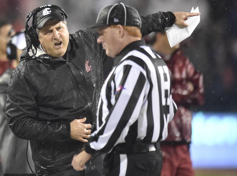 WSU head coach Mike Leach, chatting with the ref in last Saturday’s game against Stanford, suggested that the Arizona State football program be investigated for stealing offensive signals during the game. The Cougars play host to Arizona State on Saturday. (Tyler Tjomsland / The Spokesman-Review)