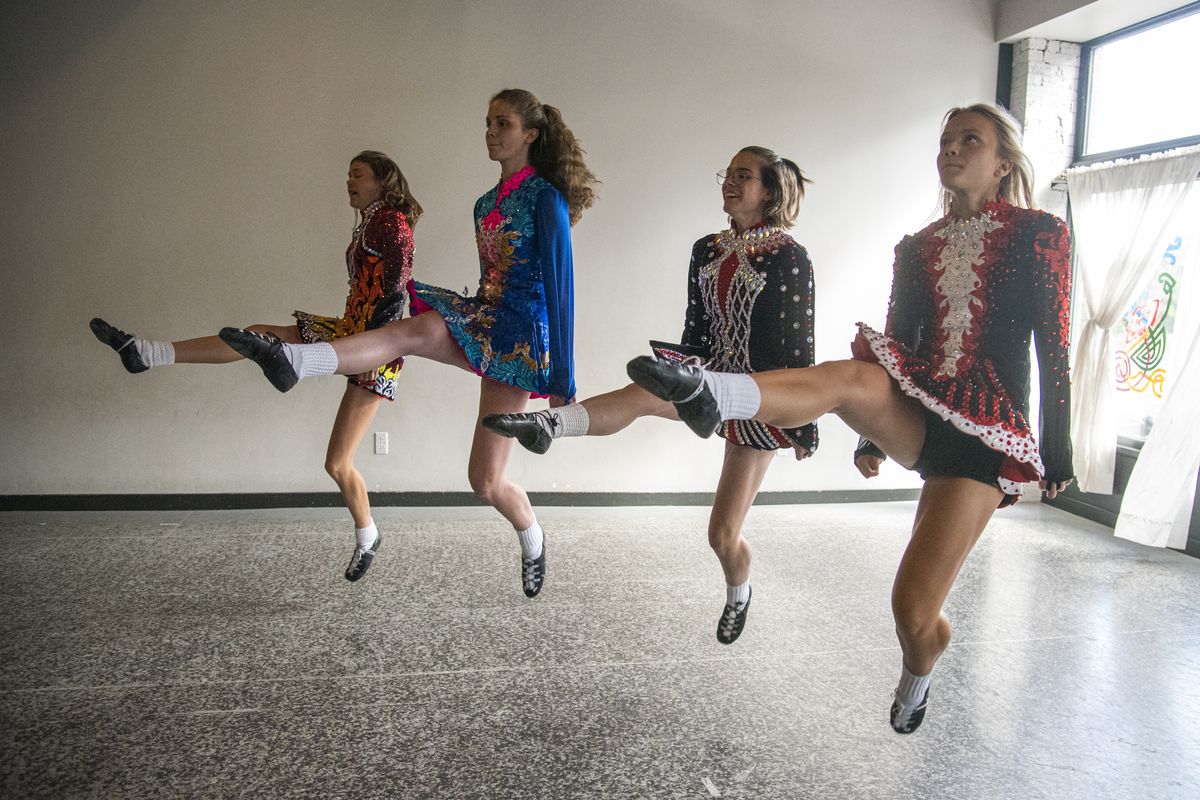Competitive dancers, from left, Lily Nielsen, 16, Ellie West, 15, Emily Drake, 17, and Kaitlin Kelly, 15, rehearse some steps at the Haran Irish Dancers studio in the Perry District Thursday, Aug. 25, 2022. The Haran studio is sponsoring the first major Irish dance competition in the Spokane area next month.  (Jesse Tinsley/The Spokesman-Review)