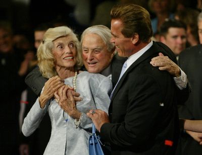 This Oct. 7, 2003, file photo shows Republican Arnold Schwarzenegger, right, being joined by in-laws Eunice Kennedy-Shriver, left, and Sargent Shriver following his victory in the California gubernatorial recall election in Los Angeles. Shriver, the exuberant public servant and Kennedy in-law whose singular career included directing the Peace Corps, fighting the 