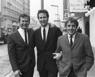 In this Jan. 31, 1967,  photo, members of the Kingston Trio, from left: Bob Shane, John Stewart and Nick Reynolds are pictured in the Hollywood section of Los Angeles. Shane, the last surviving original member of the popular folk group, died Sunday, Jan. 26, 2020, in Phoenix. He was 85. (Anonymous / Associated Press)