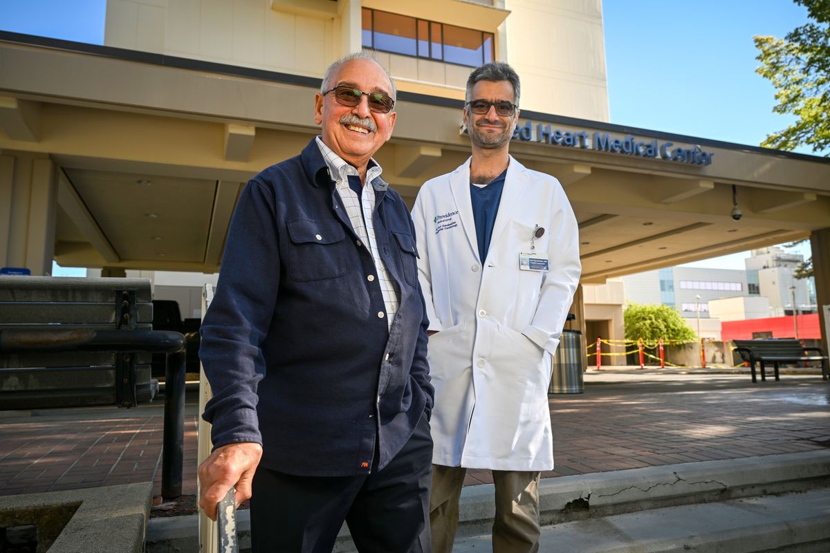 Dr. Hrair Garabedian, left, and his son Dr. Carl Garabedian stand outside Providence Sacred Heart Medical Center May 30. The elder has been working in Spokane since 1971 and is credited as a founder of the Providence Children’s Hospital.  (Jesse Tinsley/The Spokesman-Review)