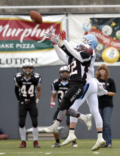 Central Valley's Brooks Johnson, behind, battles North Central's Jake Healy (22), front, for a long pass, Thursday, Oct. 8, 2015, at Joe Albi Stadium. Neither could taken possession. CV beat NC handily, 43-0. (Jesse Tinsley / The Spokesman-Review)