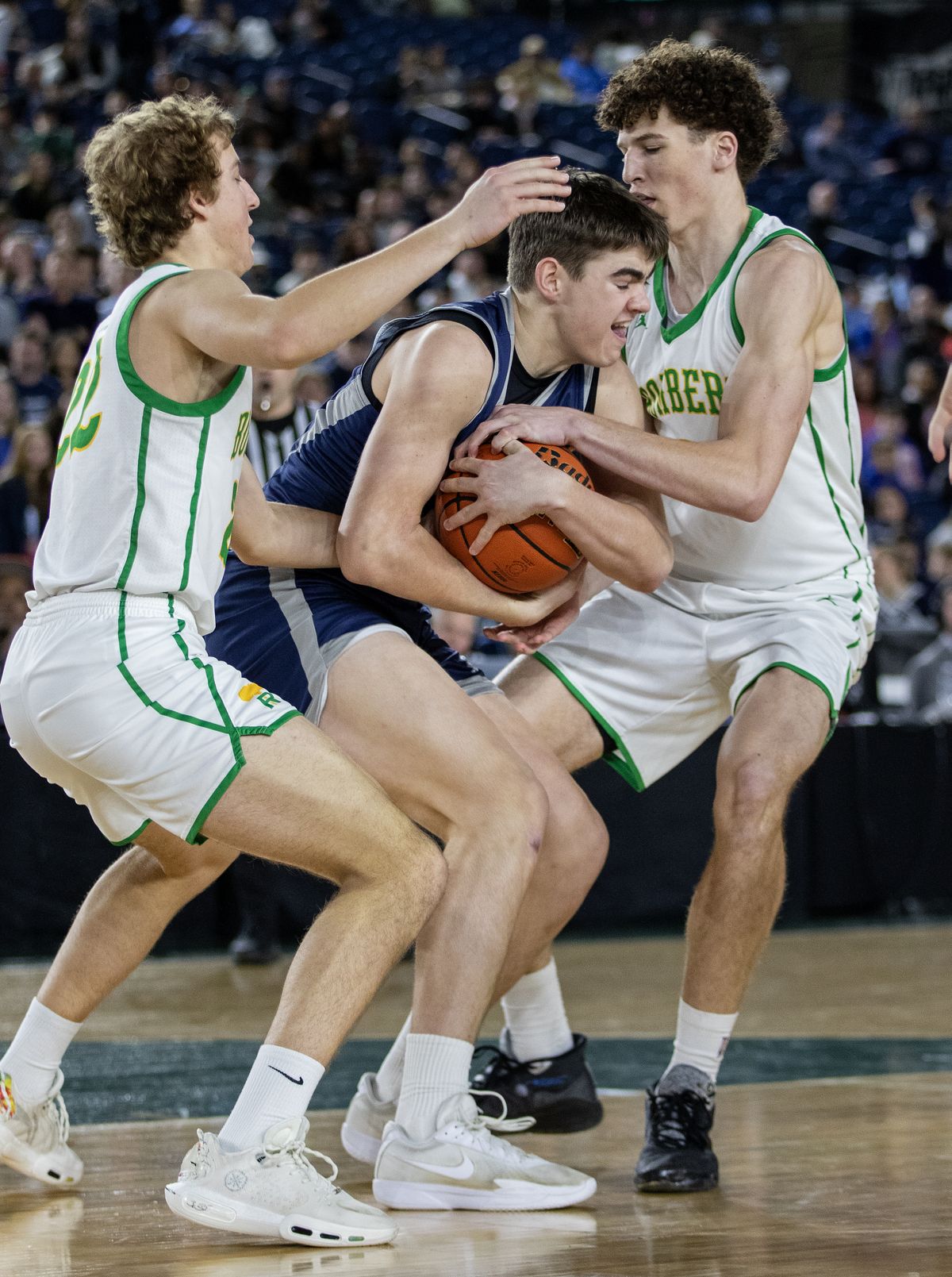 Gonzaga Prep’s Jackson Mott, middle, attempts to keep the ball from Richland’s Lance Horntvedt, right, and Jackson Woodard, left, during action in the 4A Boys State Basketball championship game in Tacoma, WA, Saturday, March 7, 2026. Gonzaga Prep lost the contest 63-49.  (Patrick Hagerty)