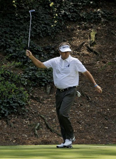 Kenny Perry reacts after making a birdie putt on the 12th hole during the second round of the Masters on Friday.  (Associated Press / The Spokesman-Review)