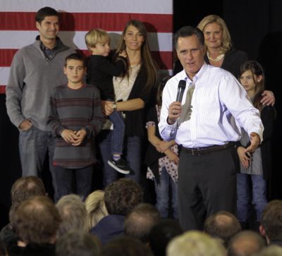 With some of his family behind him, Republican presidential candidate, former Massachusetts Gov. Mitt Romney speaks during a campaign stop, Monday, Jan. 9, 2012, in Bedford, N.H. (AP/Jim Cole)
