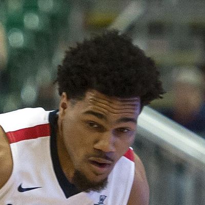 Gonzaga guard Silas Melson (0) dribbles the ball around Portland guard Alec Wintering (2) during the second half in Saturday’s WCC tournament game. (Colin Mulvany / The Spokesman-Review)