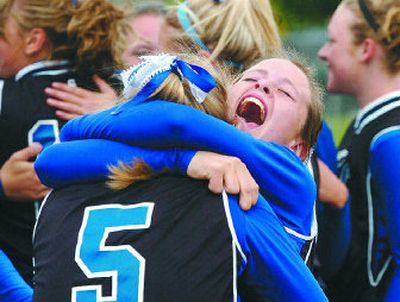 
Amanda Brouillard, facing, hugs Coeur d'Alene teammate Jessica Kraft after the Vikings dispatched Borah in the State 5A title game. 
 (Jesse Tinsley / The Spokesman-Review)