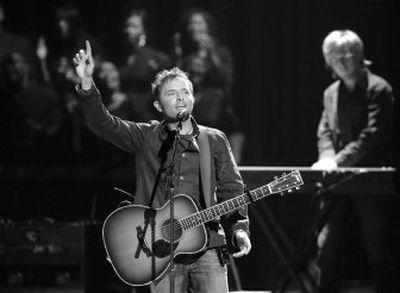 
Gospel artist Chris Tomlin performs at the Dove Awards on Wednesday in Nashville, Tenn. 
 (Associated Press / The Spokesman-Review)