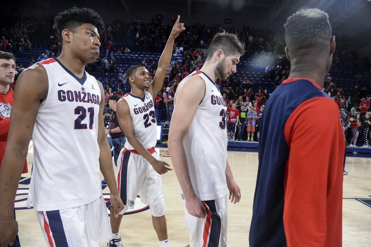 Gonzaga guard Zach Norvell Jr. celebrates Saturday’s win over San Francisco as he leaves the court with Rui Hachimura (21) and Killian Tillie (33). (Dan Pelle / The Spokesman-Review)