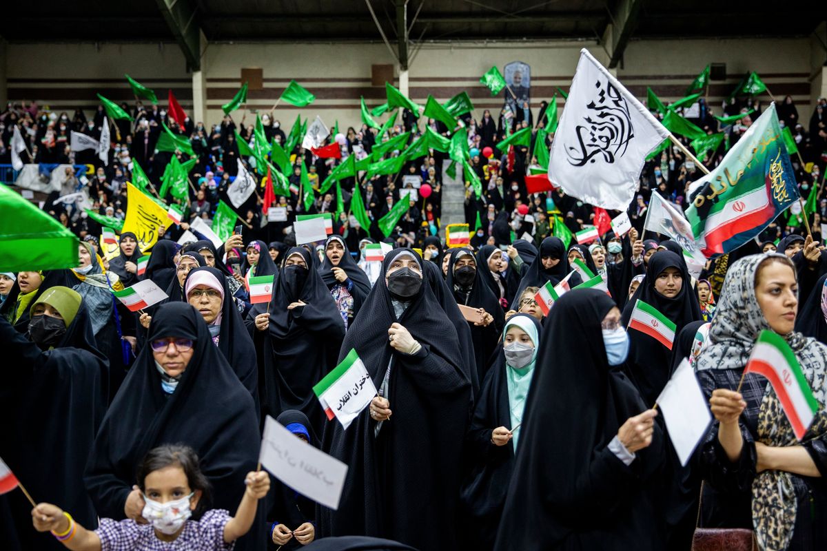 FILE -- Women in favor of the mandatory hijab at a rally in Tehran, July 12, 2022. Defiant resistance to Iran