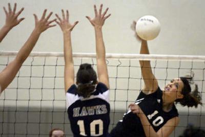 
Moscow's Kelsey Taylor, right, slams one past Skyview's Jenna Freestone in the State 4A volleyball title match on Saturday.
 (Tom Davenport/ / The Spokesman-Review)