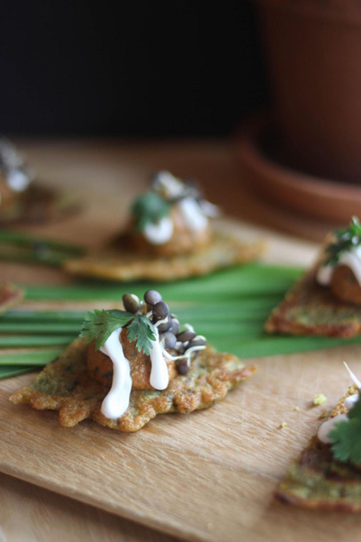 These Triple Lentil Bites feature Sprouted Lentils, Curried Lentil Socca and Coconut Crema. (courtesy of Alycia Rock)