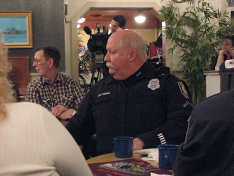 Hillyard neighborhood resource officer Kim Thomas listens at meeting in Hillyard on 15/12/2010 (Pia Hallenberg)