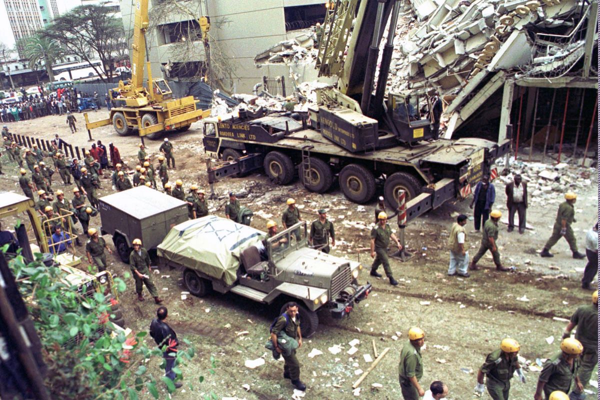 FILE - In this Sunday, Aug. 9, 1998 file photo, Israeli soldiers bring in heavy lifting equipment to the wreckage of the Ufundi House, adjacent to the U.S. embassy in Nairobi. The United States and Israel worked together to track and kill Abu Mohammed al-Masri, a senior al-Qaida operative in Iran earlier this year, a bold intelligence operation by the two allied nations that came as the Trump administration was ramping up pressure on Tehran. Al-Masri was gunned down in a Tehran alley on August 7, 2020 the anniversary of the 1998 bombings of the U.S. embassies in Nairobi, Kenya, and Dar es Salaam, Tanzania. Al-Masri was widely believed to have participated in the planning of those attacks and was wanted on terrorism charges by the FBI.  (SAYYID AZIM)