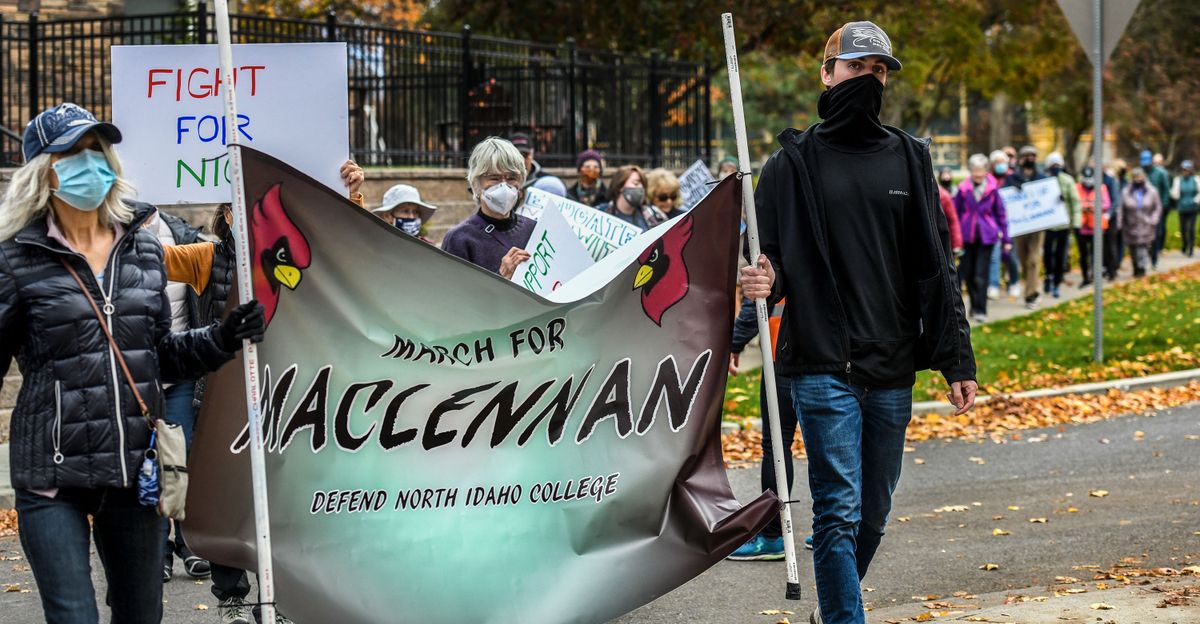 Marchers make their way to North Idaho College in Coeur d’Alene in support of former NIC President Rick MacLennan prior to the regularly scheduled meeting of the NIC board on Wednesday.  (Kathy Plonka/The Spokesman-Review)