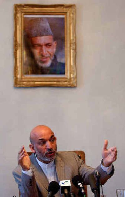 
Afghan President Hamid Karzai answers reporters' questions during a press conference at the Presidential Palace in Kabul, Afghanistan, Sunday. 
 (Associated Press / The Spokesman-Review)