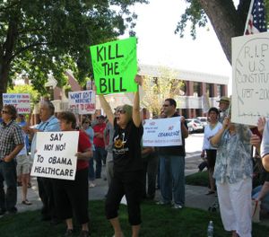 Counter-protesters shout from the back during a health care reform rally in Boise on Wednesday. (Betsy Russell / The Spokesman-Review)