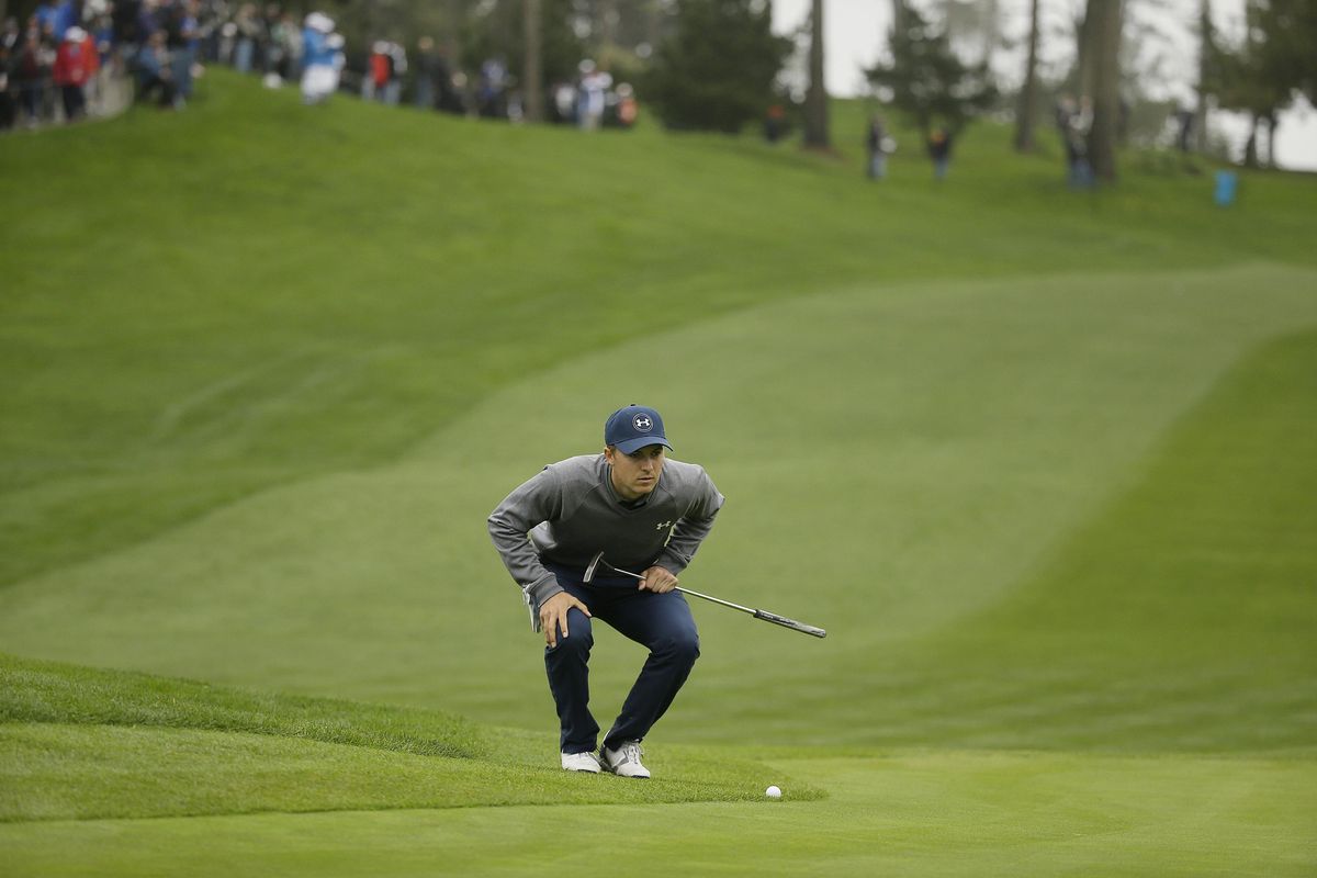 Jordan Spieth reads the 10th green of the Spyglass Hill Golf Course during the second round of the AT&T Pebble Beach National Pro-Am golf tournament Friday, Feb. 10, 2017, in Pebble Beach, Calif. (Eric Risberg / Associated Press)