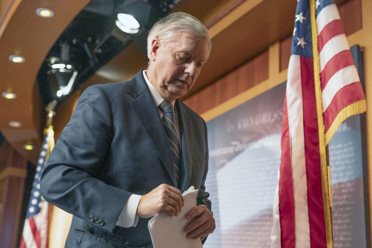 Sen. Lindsey Graham, R-S.C., walks off after speaking to reporters during a news conference at the U.S. Capitol on Thursday in Washington. Graham said Thursday that the president must accept his own role in the mob violence that occurred at the U.S. Capitol.  (Manuel Balce Ceneta)