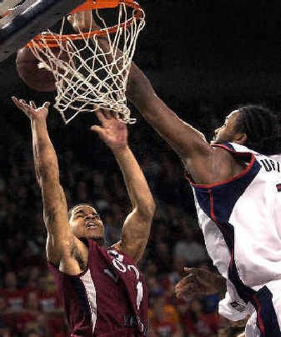 
Gonzaga's Ronny Turiaf blocks a shot by Charles Brown of Loyola Marymount late in the second half. Turiaf bounced back from a recent scoring slump to put in 16 points. 
 (Brian Plonka / The Spokesman-Review)