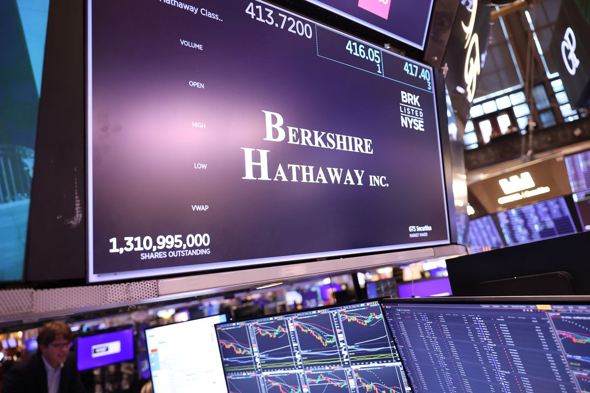 The Berkshire Hathaway Inc. company logo is displayed on a screen at the New York Stock Exchange during morning trading on Aug. 6 in New York City.  (Michael M. Santiago)