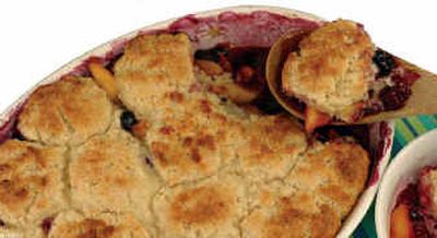 
Peach and Berry Almond Cobbler combines delectable summer fruits in a familiar dessert with a nontraditional bonus almond flavor in its dough, which includes almond paste. It's simple to make from scratch. 
 (Associated Press / The Spokesman-Review)