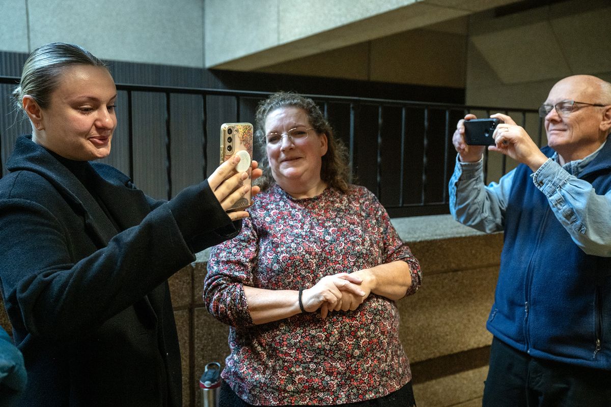 Meghan George, left, who was a witness at Lucky’s Bar in 2022, talks to Nate Beier via a video call with Beier’s mother, Kym, and family friend Ron Hauenstein.  (Jesse Tinsley/The Spokesman-Review)