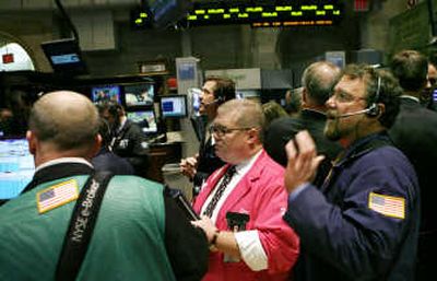 Traders work on the floor of the New York Stock Exchange Friday. Associated Press
(Associated Press / The Spokesman-Review)