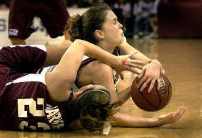 
Santa Clara's Tori Markey separates Gonzaga's Ashley Burke, top, from the ball during the WCC tournament championship game Sunday.
 (Brian Plonka / The Spokesman-Review)