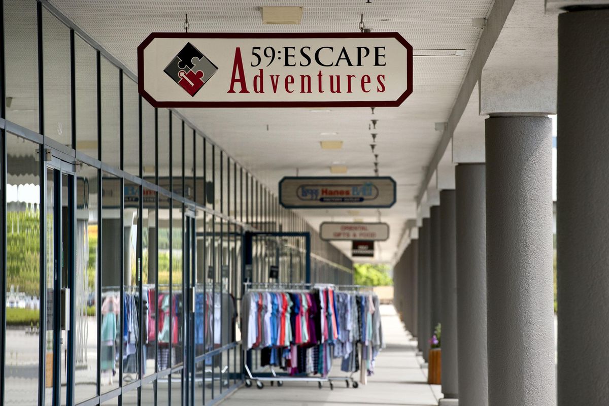 The former Post Falls Factory Outlets site remained vacant for decades. But now, it's bustling with activity and is 95% full since Thomas Tedder purchased the building in 2016. The outlets are photographed on Thursday, August 15, 2019. (Kathy Plonka / The Spokesman-Review)