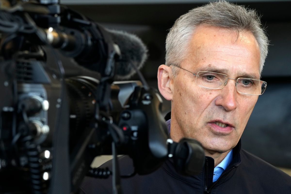 NATO Secretary General Jens Stoltenberg speaks to the media at Lask air base in Poland, Tuesday, March 1, 2022. Their meeting took place as Russian shelling pounded civilian targets in Ukraine