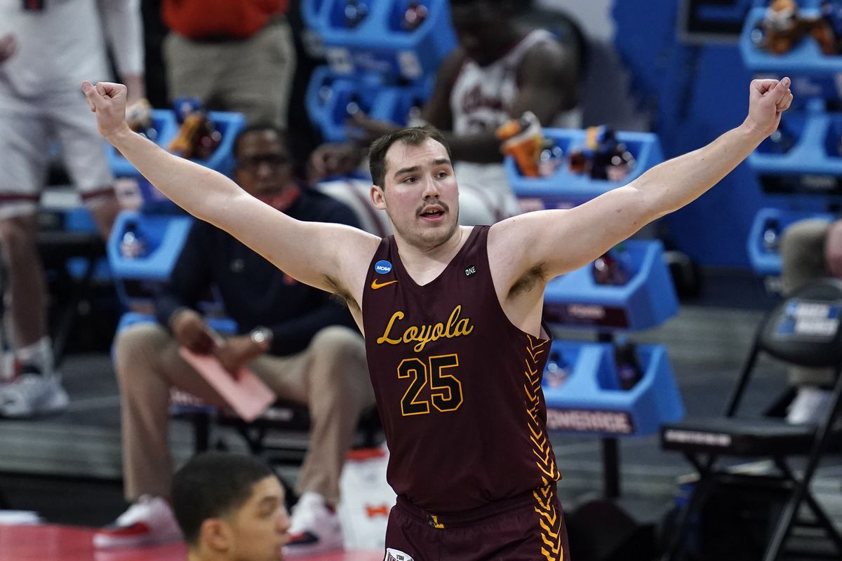 Loyola Chicago center Cameron Krutwig (25) reacts to a basket against the Illinois during the second half of a men