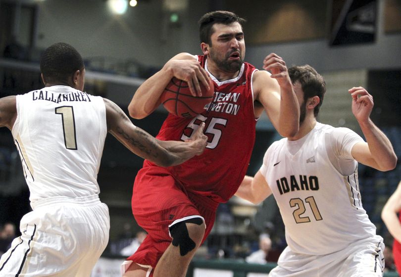 Eastern Washington forward Venky Jois (55) drives to the basket between Idaho’s Perrion Callandret (1) and Arkadiy Mkrtychyan (21) during the first half of an NCAA college basketball game in the Big Sky Conference men’s tournament in Reno, Nev., Thursday, March 10, 2016. (Lance Iversen / Associated Press)
