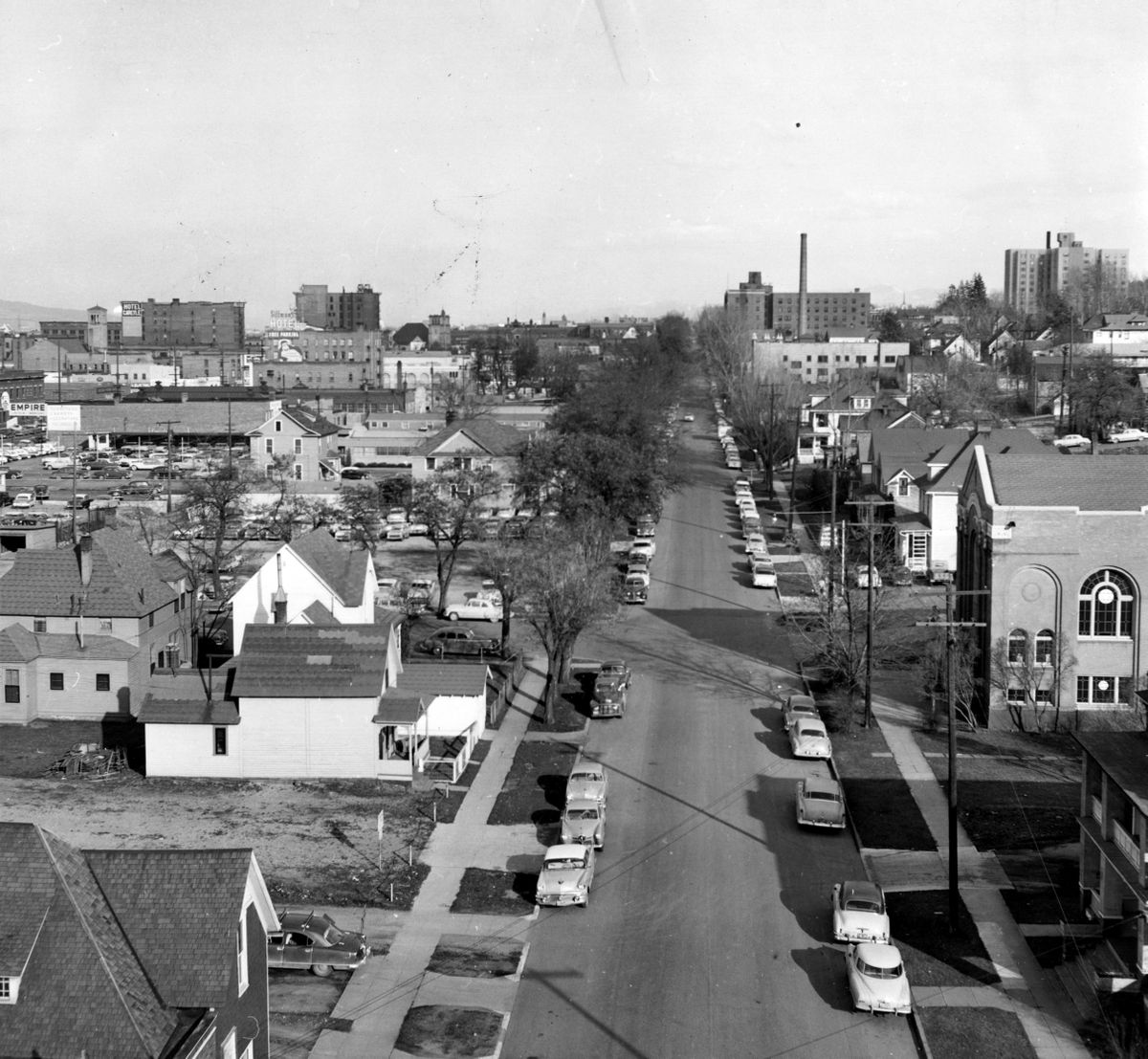 March 21, 1958: Looking east down Fourth Avenue from Cedar Street in Spokane. The house of worship on the right is Keneseth Israel Synagogue.