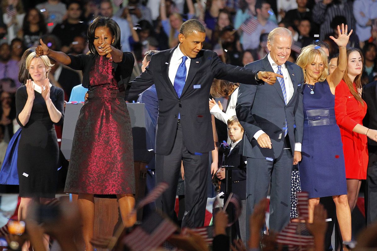 President Barack Obama , joined by  his wife Michelle, Vice President Joe Biden and his spouse  Jill acknowledge applause  after Obama delivered his victory speech to supporters gathered in Chicago early Wednesday Nov. 7 2012. (Jerome Delay / Associated Press)