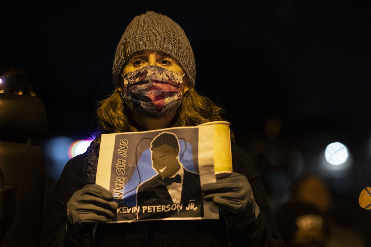 People gather for Kevin Peterson Jr., who was killed in a shooting with police involved, at a candlelight vigil on Oct. 30 in Vancouver, Wash.  (Associated Press)